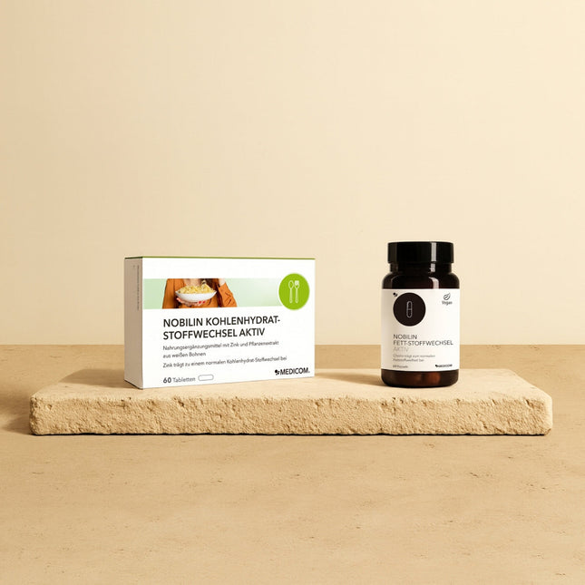 Das Figur-Set von Medicom mit der Faltschachtel von Nobilin Kohlenhydrat-Stoffwechsel Aktiv und Nobilin Fett-Stoffwechsel Aktiv