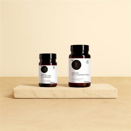 Das Figur-Set von Medicom mit der Dose von Nobilin Kohlenhydrat-Stoffwechsel Aktiv und Nobilin Fett-Stoffwechsel Aktiv